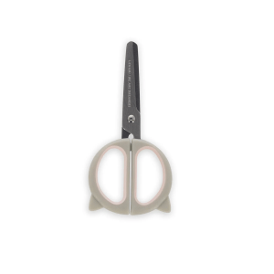 A grey pair of cat-themed scissors, closed and positioned with the blades facing upwards. The handles are shaped like a cat's face with pointy ears and a pink interior. The metal blades have text on one side. The scissors are standing upright on a white background.