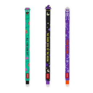 Three novelty pens with Halloween themes are arranged vertically on a white background. From left to right: The first pen is green with a Zombie head at the top and the words "All You Can Eat" printed down its length. It's adorned with small illustrations of brains and burgers. The second pen is black with a cat wearing a witch's hat at the top, followed by the text "The Dark Side Of The Meow." It's decorated with tiny stars, crescent moons and purple clouds. The third pen is purple with a skeleton at the top, and the phrase "Rock 'n' Bone" is written vertically. This pen features disco balls, tiny stars & music notes. All three pens have the "LEGAMI MILANO" logo at the bottom.