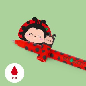 A Legami ladybug-themed erasable pen, uncapped to reveal the writing tip, positioned on a pale green background. The red barrel features black hearts, dots, and the text "GET LUCKY" with a green four-leaf clover. A white circular icon in the bottom left shows a red droplet labelled "RED" to indicate the ink colour, and a decorative cartoon ladybug face is visible in the background.